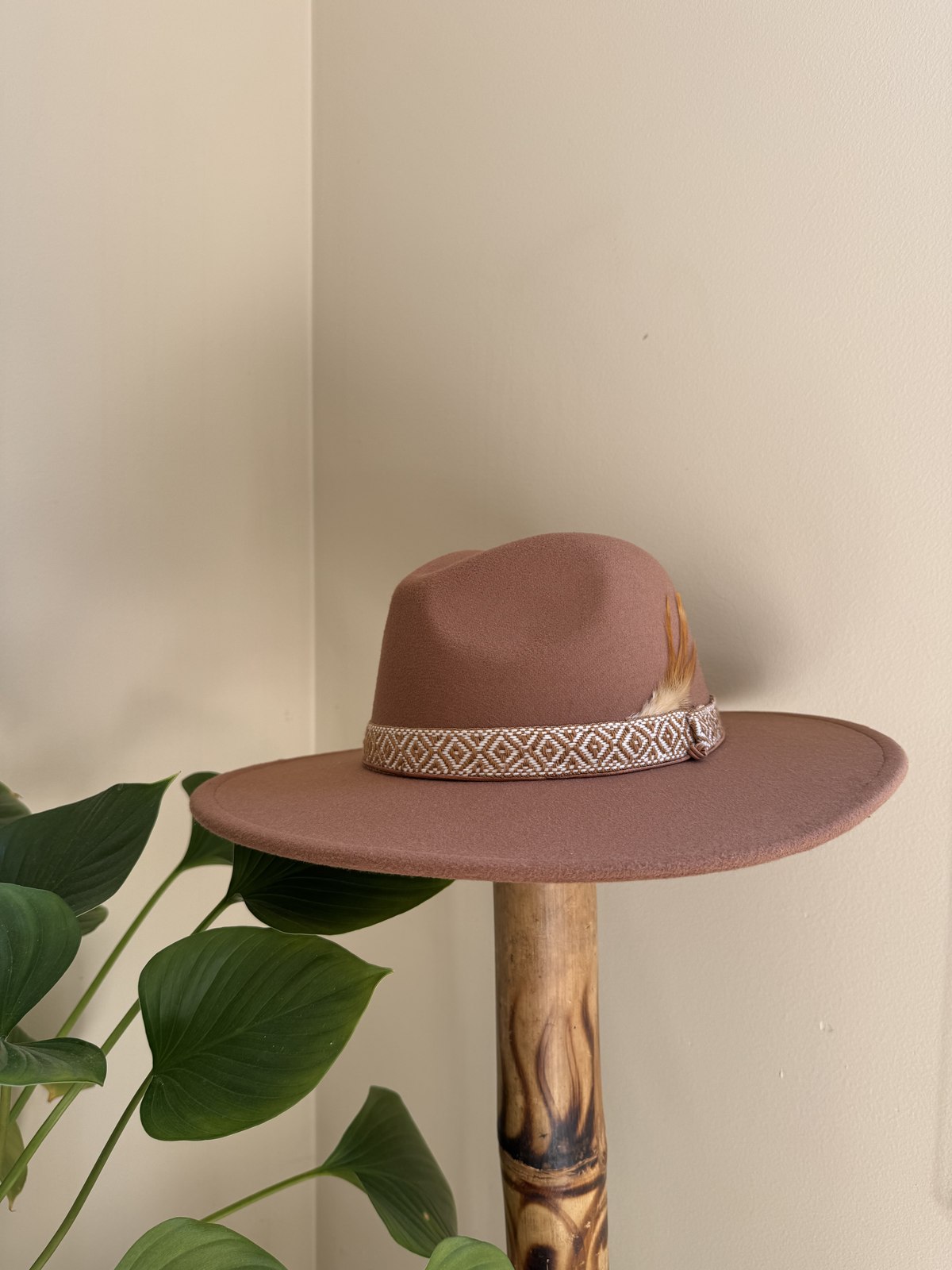 Dusty rose fedora with striped woven band and feather