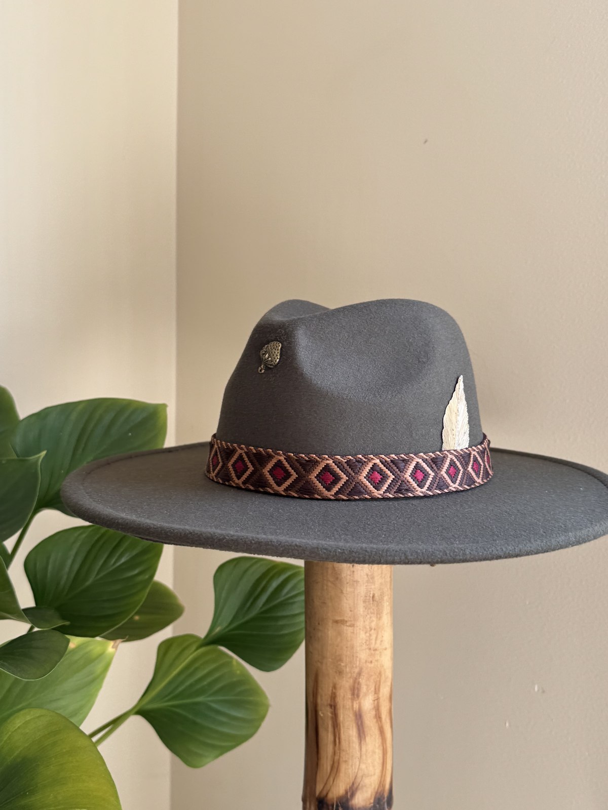 Olive fedora with diamond woven band and silver feather pin