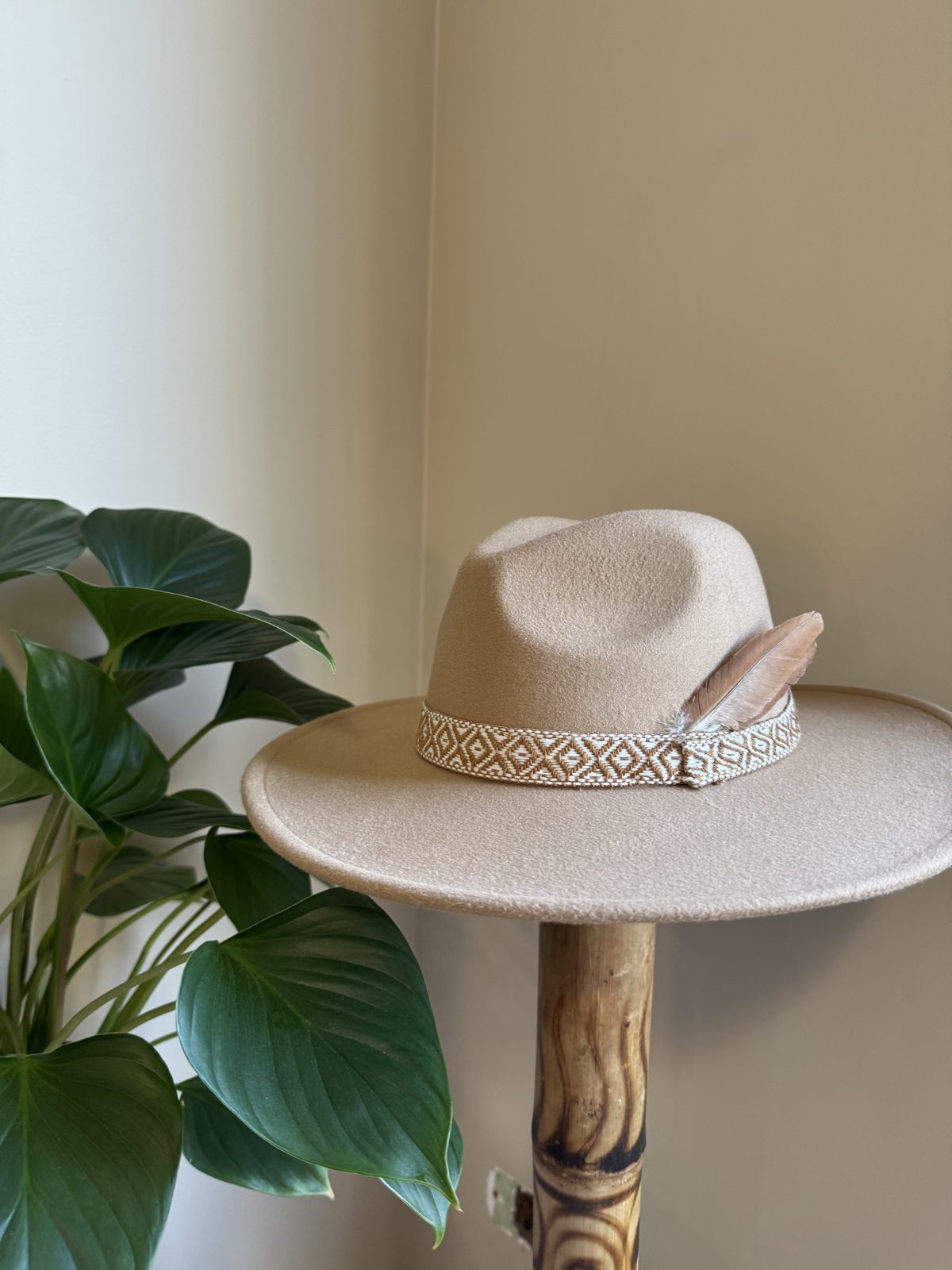 Cream fedora with patterned strap