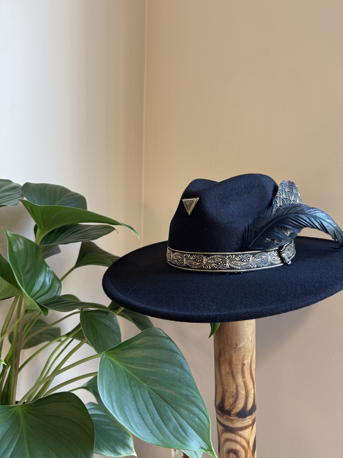Navy fedora with silver studded band and feather