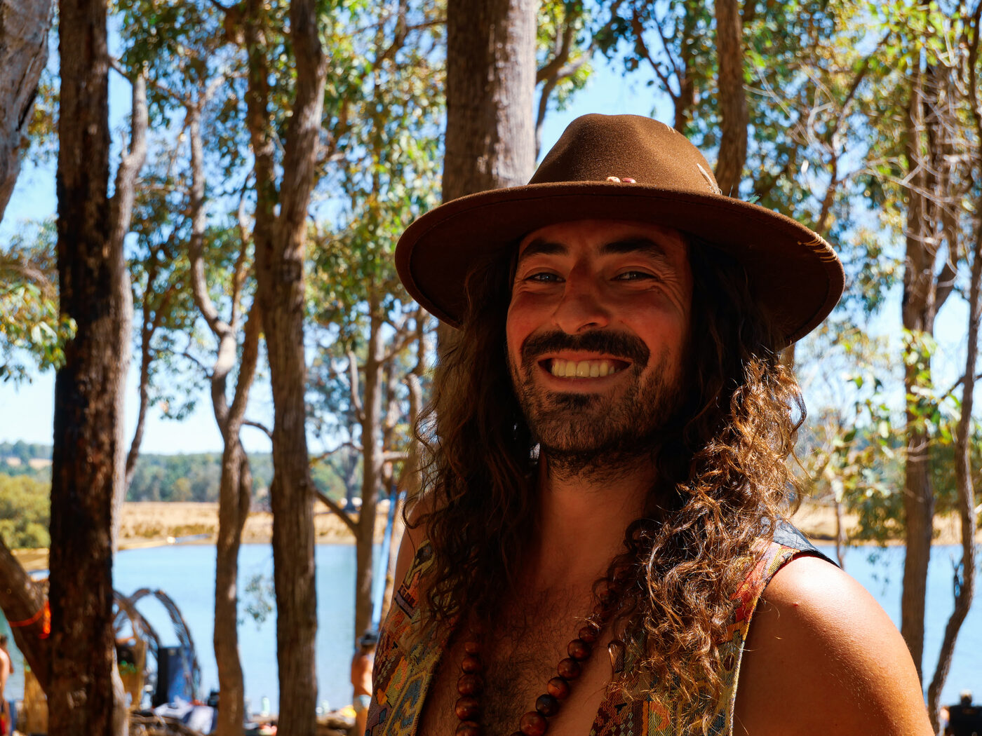 Founder of JHATS_CO wearing a felt hat outdoors